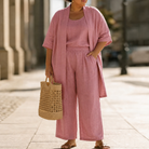 Individual pieces of the Lila relaxed three-piece set laid flat in wine red, demonstrating their potential for separate styling.