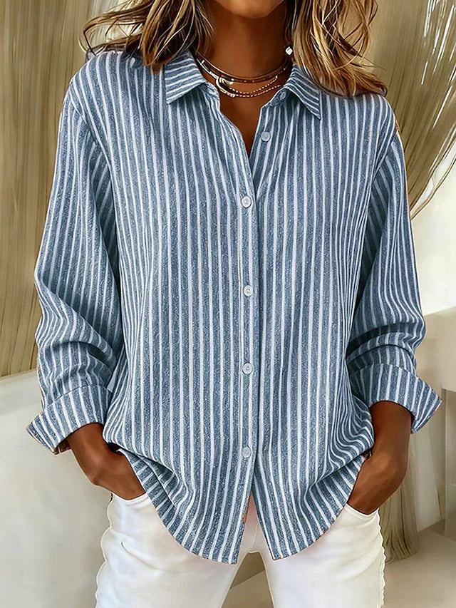 Front view of the blue Linnea relaxed fit shirt, showcasing its classic collar and button closure.