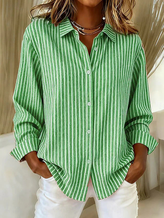 Side profile of a model wearing the green Linnea relaxed fit shirt, highlighting its loose drape and long sleeves.