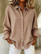 Detailed close-up of the khaki Linnea relaxed fit shirt fabric, showing the visible vertical stripes.