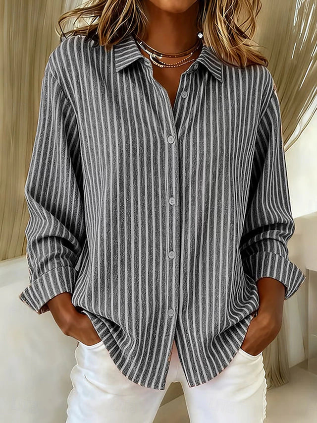 A model casually styled in the gray Linnea relaxed fit shirt, emphasizing its comfortable and unrestricted movement.