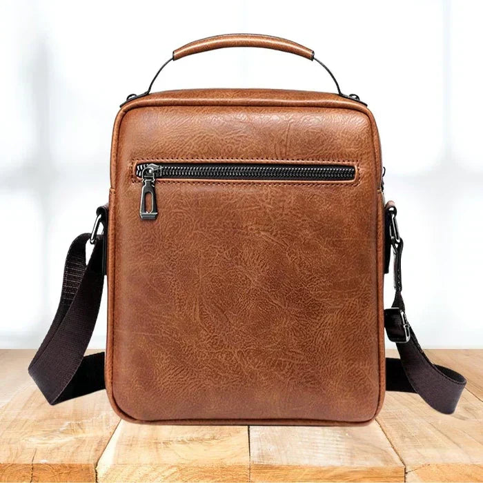 Caleb shoulder bag in black, displayed on a clean surface, emphasizing its sleek and modern aesthetic.