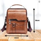 A man reaching into the Caleb shoulder bag, illustrating the ease of access to his essential belongings.