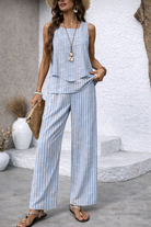 Full-length view of Maeve striped wide-leg pants in fresh blue tones, showcasing their relaxed fit and elegant vertical stripe design.