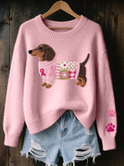 Close-up of a women's Maeve T-shirt in pink, showing the detailed dachshund felt pattern with a small bow.