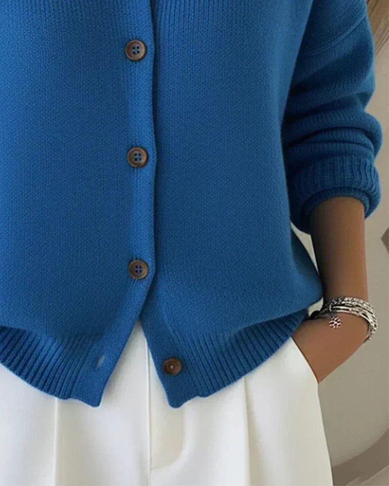 Model wearing the Maeve classic button-up cardigan in red, styled for a casual, comfortable look.