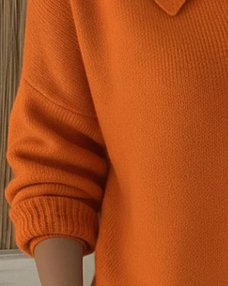 Back view of the Maeve classic button-up cardigan in orange, illustrating its harmonious line and relaxed silhouette.