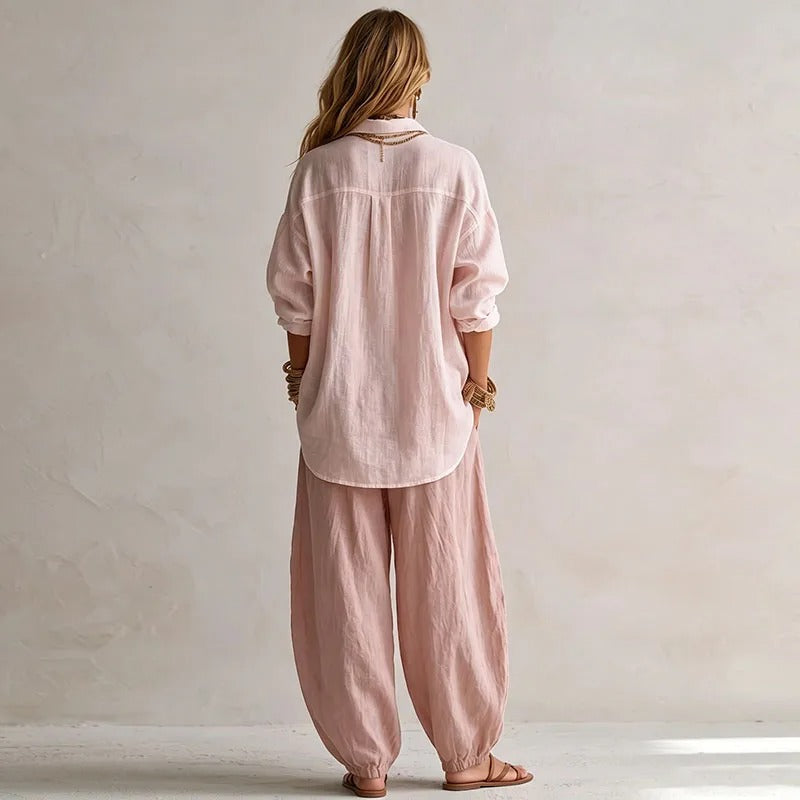Full-length shot of elegant black high-waisted trousers, showcasing their flattering wide-leg silhouette.