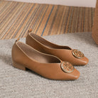 Overhead shot of green square-toe flats, highlighting the modern square toe design and easy slip-on convenience.
