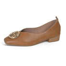 Bottom view of a green square-toe flat, showcasing the durable rubber outsole and stable heel structure for everyday wear.