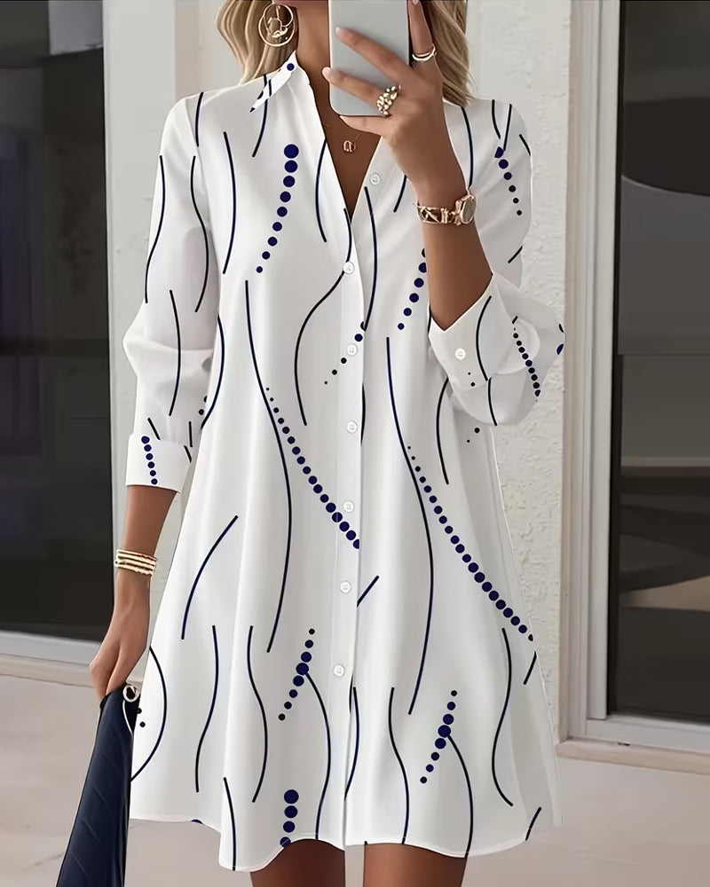 Side profile of a model wearing the white Kira striped A-line dress, highlighting the regular fit and above-knee length.