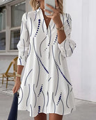 Back view of the Kira striped A-line dress, emphasizing the flow of the cotton blend fabric and overall silhouette.