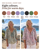 Green Xylia blouse featuring its comfortable, loose fit, making it an ideal everyday blouse.