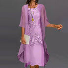 Lifestyle image of the Noelle two-piece dress in a celebratory setting, demonstrating its occasion wear suitability.