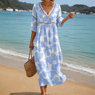 Front view of the Odessa Relaxed Silhouette Dress in a delicate blue floral pattern, styled for a comfortable summer look.