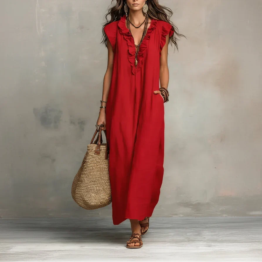 A woman's hand casually placed in one of the deep, functional pockets of the bohemian long maxi dress.