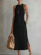 Frontal view of the Eleni midi dress in yellow, showcasing the full length and how it enhances the wearer's figure.