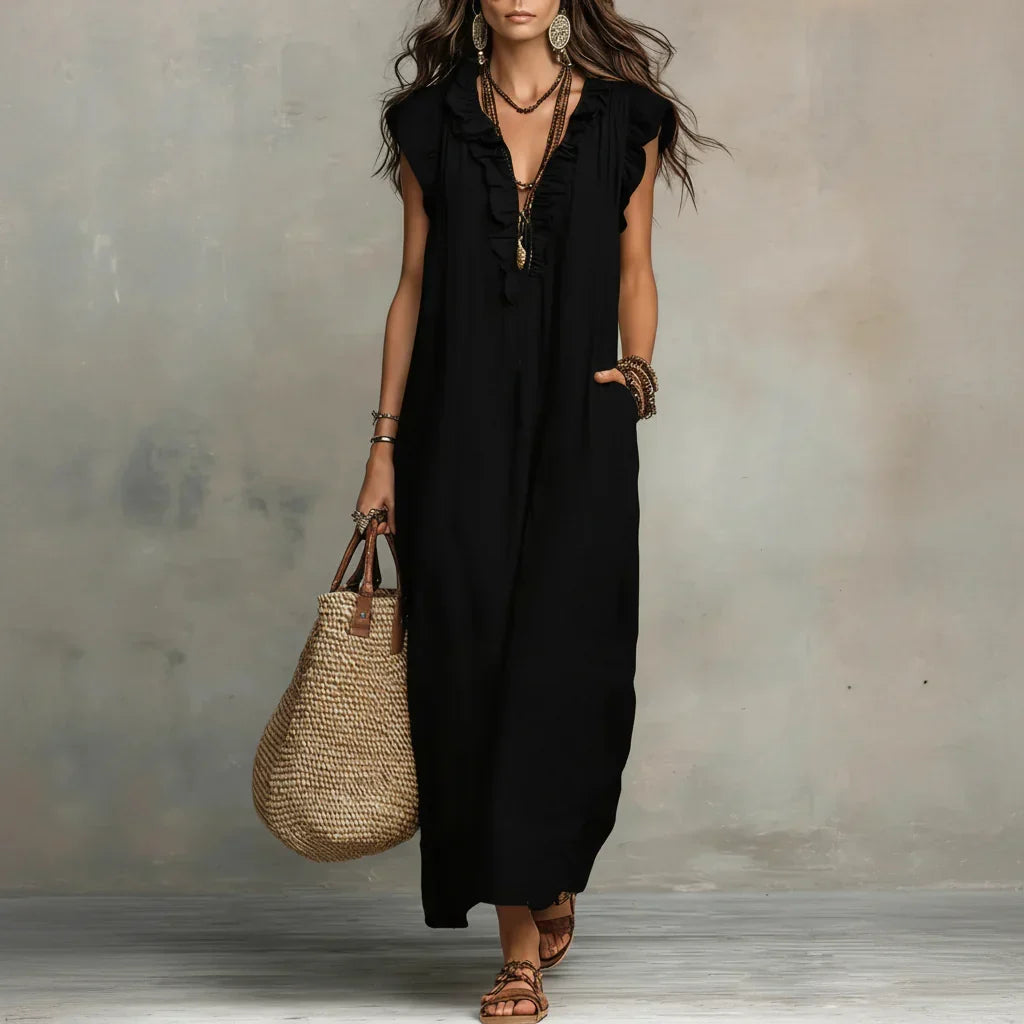 Lifestyle shot of a woman enjoying a warm afternoon, wearing the comfortable bohemian long maxi dress.