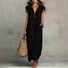 Lifestyle shot of a woman enjoying a warm afternoon, wearing the comfortable bohemian long maxi dress.
