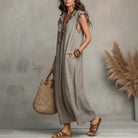 Detail of the fabric texture and subtle pattern of the Saskia long maxi dress, showing its quality.
