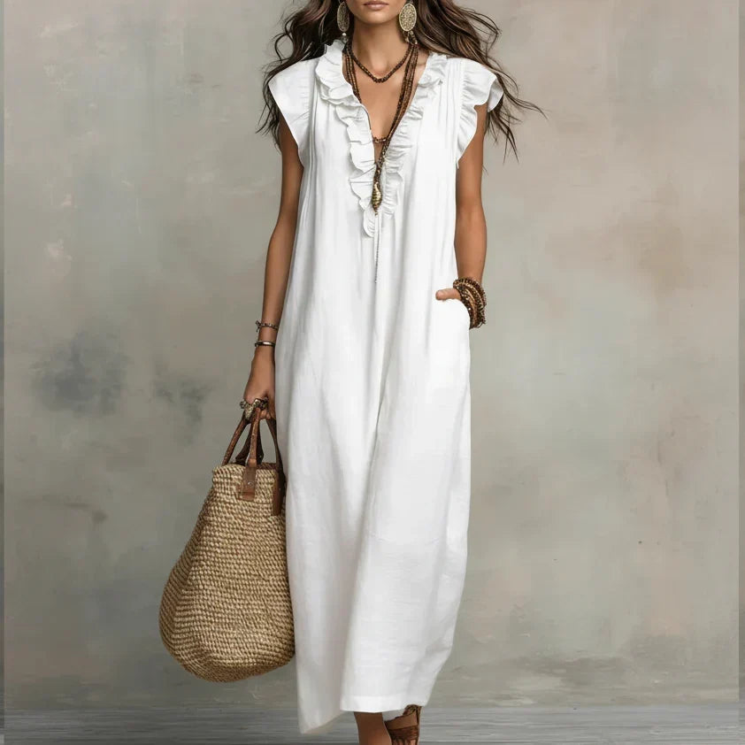 Back view of the Saskia long maxi dress, highlighting the elegant drape of the natural fabric.