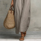 A model sitting relaxed, demonstrating the comfort and ease of the Saskia Bohemian Long Maxi Dress.