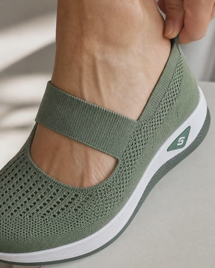 Stepping into the Carry slip-on standing up using the heel tab