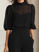 Back view of the black chiffon three-piece set, showing the graceful silhouette and the length of the sheer top.