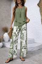 Front view of Sable botanical wide-leg pants in a neutral tone with a detailed nature-inspired print, styled for a relaxed elegant look.
