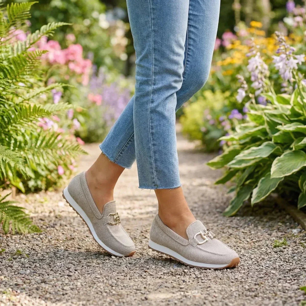 Model wearing beige orthopedic pants in a casual setting, illustrating their versatility and style.