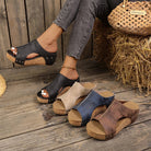 Overhead view of a pair of Solange studded wedge sandals, emphasizing the overall design and breathable construction.