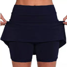 Side view of the light gray active skort, illustrating the short underlayer and overall athletic look.