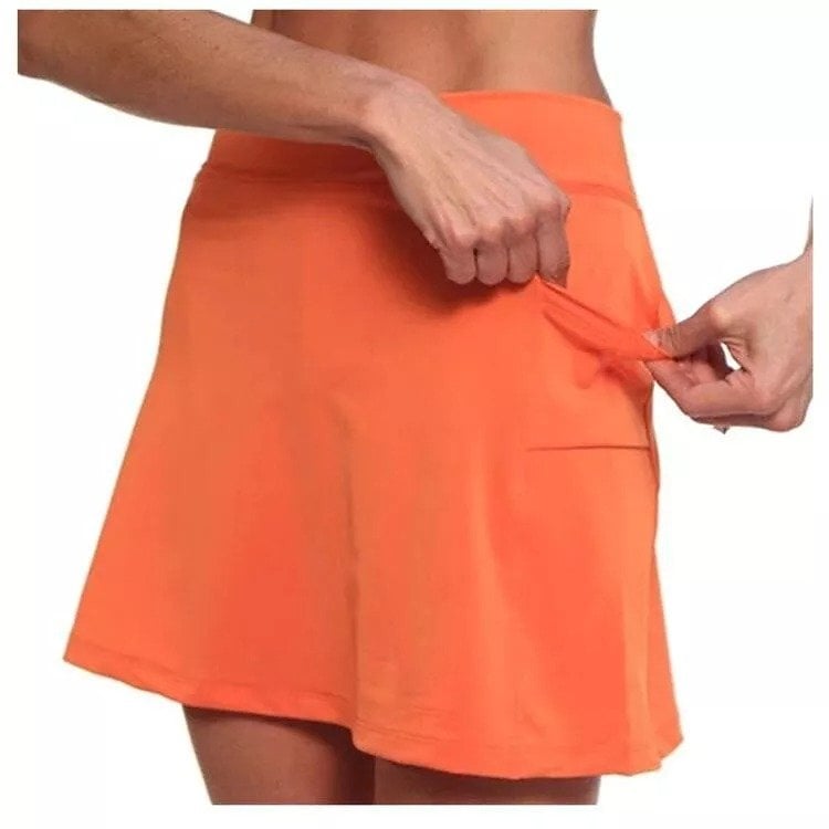 Casual outdoor scene with a model wearing the light gray skort, ideal for a comfortable day out.