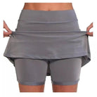 Front view of an orange anti-chafing active skort, featuring its vibrant color and practical pockets.