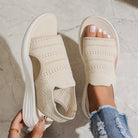 Detailed view of the lightweight sole on a blue pair of platform sandals, illustrating its height and comfort.