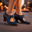 Side view of Talia elegant leather lace heels in black, showcasing the sculpted heel.