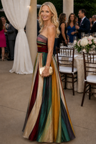 Model enjoying an outdoor setting in the versatile Thalia strapless A-line dress, demonstrating its comfort and style.