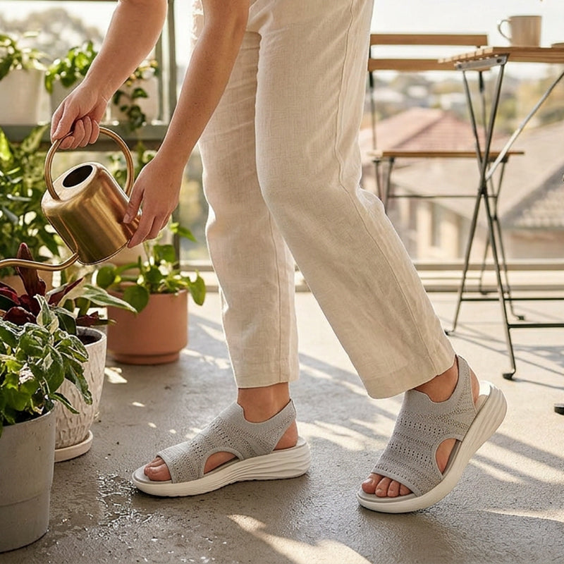 Black platform sandals placed on a clean surface, emphasizing their versatile design for various outfits.