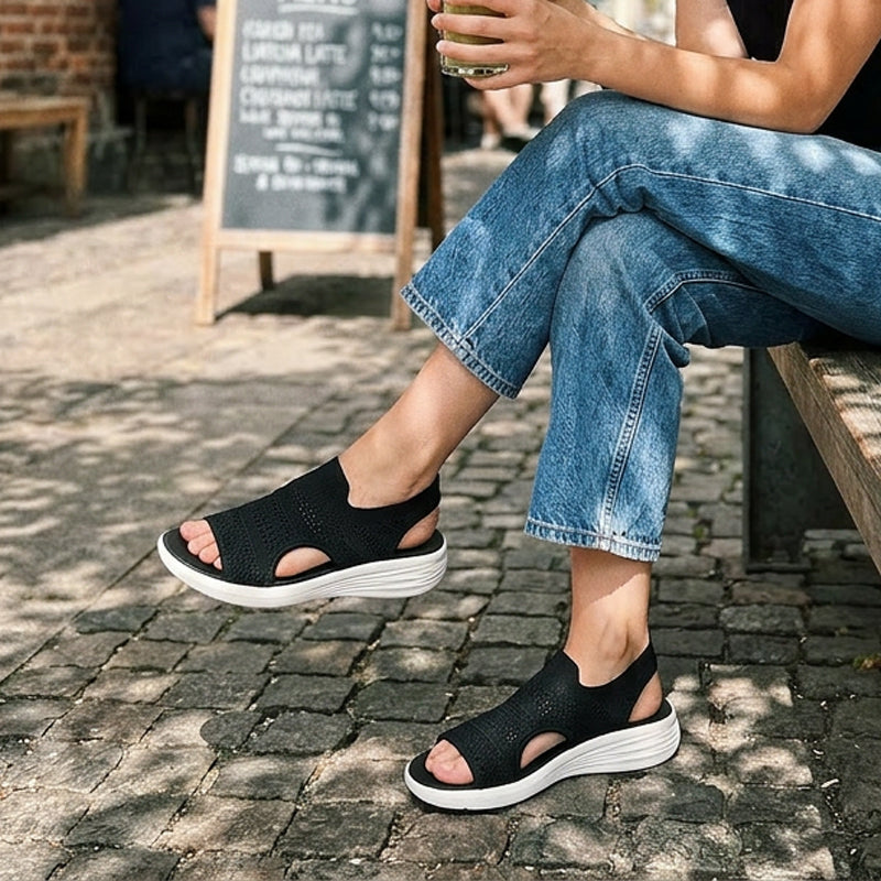 Pink knit platform sandals styled with a summer dress, perfect for a relaxed yet elevated look.