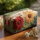 Close-up of a Vera quilted cosmetic bag in a luminous petal print, showcasing its elegant texture and secure zip closure.