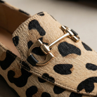 Woman wearing Wren elegant loafer shoes in a casual setting, demonstrating versatile styling.